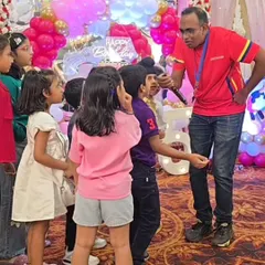 Our coach engaging with the kids in a banquet hall setting. We are experts at managing groups and keeping the energy high, no matter the location.