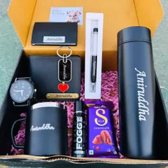 This all-in-one men's gift hamper is fully personalized for "Aniruddha". It contains a watch, wallet, keychain, card holder, pen, mug, and temperature bottle, plus some extra treats like perfume and chocolate.