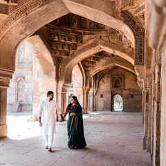 A walk through the ancient corridors of a Delhi fort, hand in hand. The play of light and shadow in these heritage locations creates a dramatic and timeless setting for your pre-wedding story.