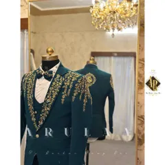 A closer look at the craftsmanship on this teal wedding suit. You can see the reflection of the back embroidery in the mirror, showing how I design the garment to be stunning from every angle.