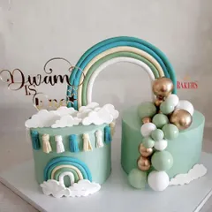 A lovely set of pastel green twin cakes for Divam's first birthday. The boho rainbow theme with tassels and a balloon garland created a cohesive and stylish look for the celebration. The flavors were rich chocolate and vanilla with mixed berries.