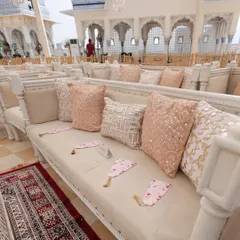 Cushions, cushions, and more cushions! For this pastel pheras ceremony, we used a mix of soft beige, off-white, and sequined cushions with silver gota and mirror work to add texture and a touch of sparkle to the guest seating.