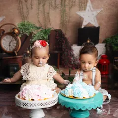 The twins curiously inspecting their individual cakes. It's so much fun to see how different their reactions can be.