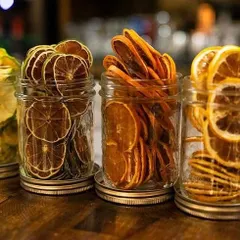We store our dehydrated fruit garnishes in airtight jars to keep them fresh and crispy. It's this attention to detail that elevates a good drink to a great one.