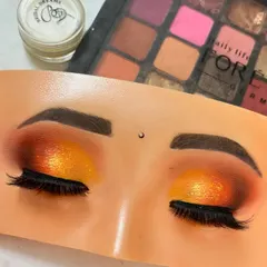 The final result of our Haldi-themed eye makeup practice. Notice the pop of shimmer on the lid and the clean blending, techniques we practice until they are perfect.