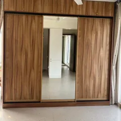 We embraced the beauty of simplicity with this stunning oak sliding wardrobe. The design features sleek, inbuilt handles and a full-length central mirror panel, blending natural texture with practical elegance to redefine the space.