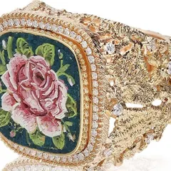 The micromosaic rose ring, a miniature painting for your hand. A detailed pink rose is set in a wide, textured 18k gold band and framed with a halo of natural diamonds.
