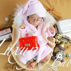 A little bit of pampering for this luxury baby. This fun, spa-day theme with a tiny bathrobe, glasses, and retro props is perfect for a baby with style.