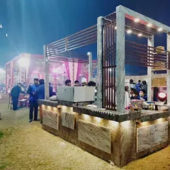 Another perspective of the modern live station, showing its sleek design and how it integrates into the overall event space.