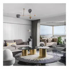 We designed this sea-facing apartment to be a story of its surroundings. The living room features custom sofas and a sculptural center table, all oriented to embrace the sprawling ocean views. The furniture is minimal yet luxurious, ensuring the focus remains on the horizon.