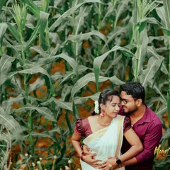 An intimate pre-wedding moment in a rustic cornfield. The natural setting provides a simple and beautiful backdrop for capturing genuine connection.