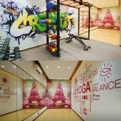 The wellness zone in our residential project in Lower Parel. We designed two distinct spaces: a high-energy gym with graffiti art and a tranquil yoga room with a calming mural, catering to different moods and fitness preferences.
