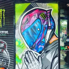 The other side of our mural for the Performance Racing store, featuring a stylized helmet and prayer hands. This piece blends modern aesthetics with a sense of respect for the ride.