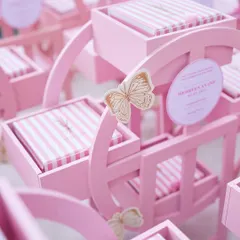 Whimsical, thoughtful, and unforgettable. These pink rocking horse hampers were created for a special birth announcement, designed to craft sweet memories, box by box.