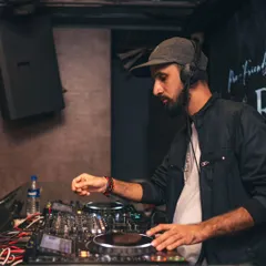 A candid shot of me cueing up the next track. Preparation and timing are everything when it comes to keeping the dance floor moving.