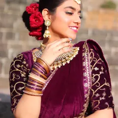 A stunning reception look featuring a rich velvet saree. We teach our students how to create glamorous evening looks with dramatic eyes and elegant updos.