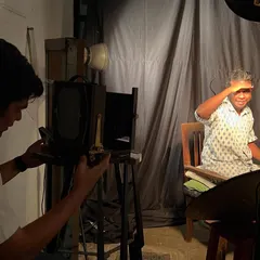 An artist sets up a portrait using a vintage large format camera for a wet plate collodion shoot. Our studio supports these historic and meticulous photographic processes, offering a unique space for photographers dedicated to the craft of analog image making.