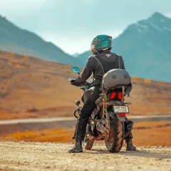 It's not just about the destination. It's about these moments on the road. I specialize in bike trip photography, capturing the rider and their machine against the epic backdrop of the mountains.