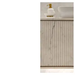 A close-up of a fluted marble vanity. The big ideas and the minute details, the craft, the thought, and the scale, must all work together to tell the tale of the space.