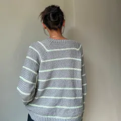 The back view of the striped sweater, showing the raglan sleeve construction which gives it a great shoulder fit.