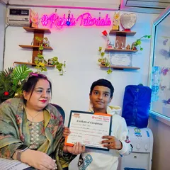 A proud moment as I present a certificate of completion to one of my bright students. Recognizing their hard work is a key part of their learning journey.