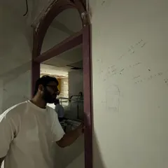 Sketching ideas directly on the wall during the construction phase. Every corner of the new store was planned with the client experience in mind.