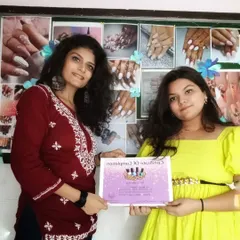 Here I am with a newly certified nail artist. My courses are designed to give you the confidence and credentials to start your own nail art business.