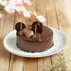 An upgrade to a classic, this is my Chocolate Panna Cotta Praline Cake. It features a glossy chocolate glaze, creamy mousse, and a surprise panna cotta center for a truly royal dessert experience.