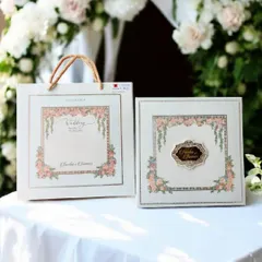 I love creating coordinated wedding stationery. This set includes a beautiful floral invitation box with a custom nameplate, along with a matching carry bag to present it to your guests in style.