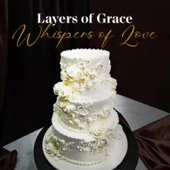 For timeless celebrations, I craft pieces like this elegant three-tier white wedding cake. The intricate, hand-piped floral details and classic rosettes create a look of pure grace and sophistication.