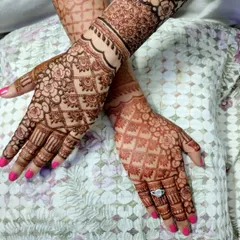 A close-up of a mature henna stain. You can see the intricate details of the floral and grid patterns, all brought to life by the rich color of my natural henna paste.