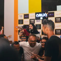 Our frontman pointing to a fan in the crowd. We make it a point to connect with our audience and make everyone feel like part of the show.