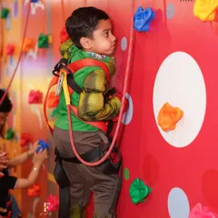 Adventure awaits on our colorful rock-climbing wall. Equipped with safety harnesses, it's a thrilling activity for kids to challenge themselves and build confidence in a secure environment.