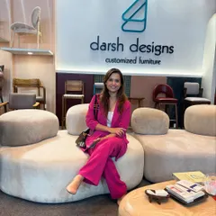 It was a pleasure to have visitors stop by our booth to see our work. Here, a guest tries out our curved, modular sofa, a centerpiece of our display.