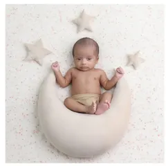 An awake and curious little star-gazer. It's always special when we capture moments with the baby's eyes open, looking right at the camera.