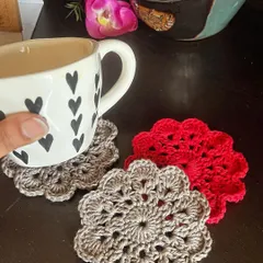 A set of my floral mandala coasters in use, adding a pop of color and texture. They are the perfect size for your favorite mug of tea or coffee.