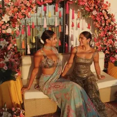 The Mehendi backdrop creates a perfect photo opportunity for the bride and her guests. The vibrant flowers and tassels make for a lively and celebratory setting.