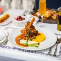 This is our signature cordero, a slow-braised lamb shank that is tender, soulful, and rich with fragrant herbs. It’s a dish that brings the warmth of my abuela’s kitchen right to your plate.