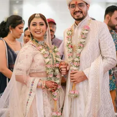 A beautiful portrait of the happy couple during their wedding ceremony. The bride's makeup is flawless, and her joy is absolutely radiant.