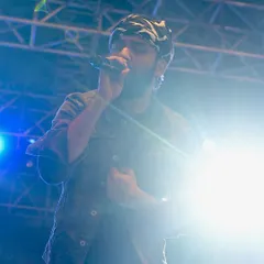 The hustle is real, but the dream is always worth it. This photo was taken during a big festival performance, capturing the energy and passion that goes into every show. It's a reminder of the journey from writing songs in my room to playing under the big lights.