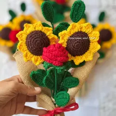 A close-up view of the sunflower and rose bouquet. You can see the detail in the crochet petals and leaves, all handcrafted to create a beautiful, lasting floral gift.