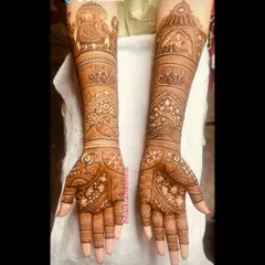 This design focuses on traditional elements like the baraat elephant and doli, combined with beautiful peacock and lotus patterns. The result is a rich, dense, and classic bridal mehendi.