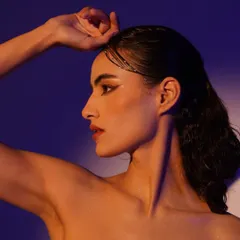 A beautiful profile portrait using split colored lighting. The warm orange and cool purple light create a stunning visual effect.