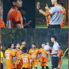 A coach explaining a drill to the U13 squad. Clear communication and instruction are key to our methods.