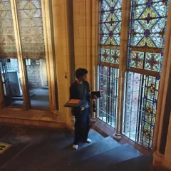 A photo of me sketching inside a beautiful old building. I find inspiration everywhere, from grand architecture to small details.