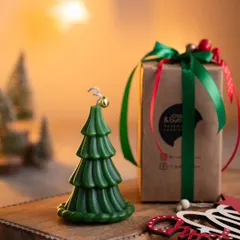 My Christmas tree candle is a hot favorite. Here it is, beautifully packaged and ready to be gifted, with its little bell on top adding a touch of magic.