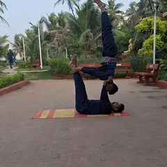 Another variation of a partner balance pose, this time transitioning into a different asana. This requires constant communication and adjustment between partners, building a unique connection alongside physical skill.