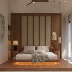 A sanctuary designed to soothe. This master bedroom blends Japandi minimalism with rich natural textures, elevated on a warm wooden platform with integrated lighting. The cane-panelled headboard and layered lighting create a space where every detail whispers calm, embodying our philosophy of warm minimalism and zen living.