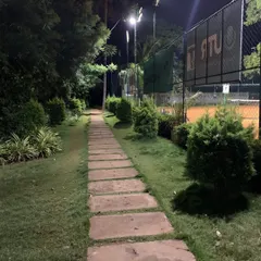 The pathway to our courts, beautifully lit for our evening sessions. We've created a welcoming and pleasant atmosphere for all our players.