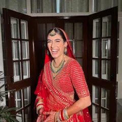 A candid moment of pure happiness. This laughing shot captures the essence of a wedding day. The makeup is designed to look fresh and beautiful from every angle, in every light.